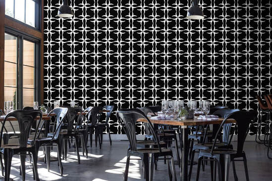 Black white geometric patterned 173ZERO 173ZBW wallpaper on wall in restaurant interior