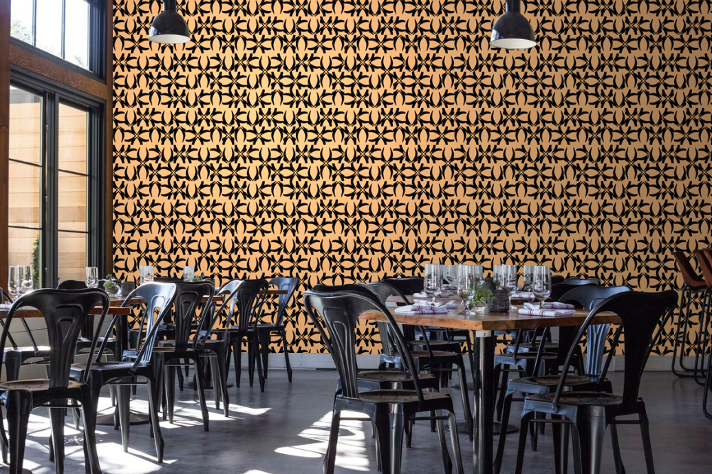 173NASH - Nevik. Pinkish salmon and black fragmented geometric wallpaper on a wall in a restaurant interior