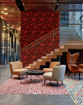 173NASH Wolf red and black patterned commercial designer wallpaper on the wall of a stairwell in a lobby interior