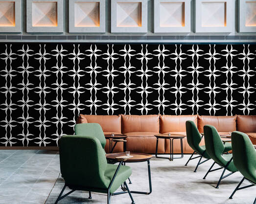 Black and white patterned 173ZERO 173ZBW designer wallpaper on a wall in a hotel lobby area