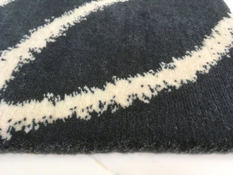 Close up of the grey and white Tribal Kimi rug