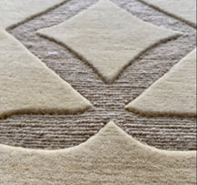 Glyph Giza luxury handmade designer rug background is cut pile and the carved out shape is a lower loop pile texture