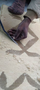 Hand clipping and carving the rug