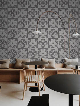 Rokusho ROKLDGY patterned wallpaper in alternating shades of light and dark grey in a coffee shop interior