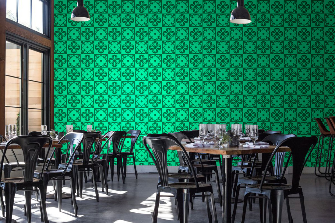 Green patterned Rokusho ROKLDGN wallpaper on a wall in a restaurant interior