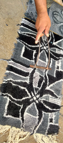 Black white and grey patterned BLOK Comic Noir rug by Luke Edwards Interior Design getting brushed by hand and being washed
