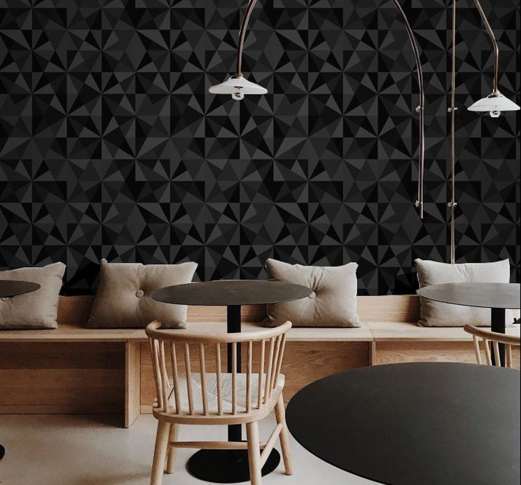 Jewel Onyx geometric patterned black wallpaper on a wall in a cafe interior