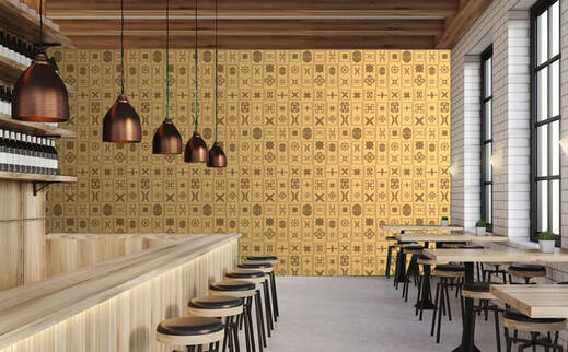 Kingdom Shay earth toned graphically patterned wallpaper on a wall in a contemporary neutral cafe interior