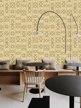 Neutral toned Glyph Giza designer wallpaper on the wall of a cafe coffee shop interior