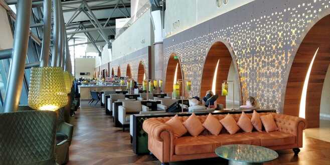 Primeclass lounge interior patterned walls comfortable seating Mucat International Airport