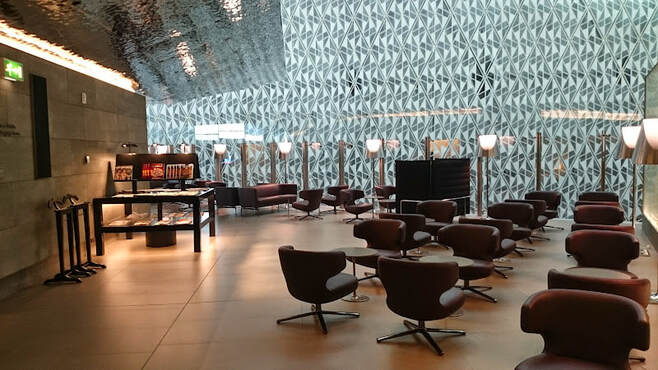 Qatar Airways Al Mourjan business lounge interior Hamad International Airport Doha